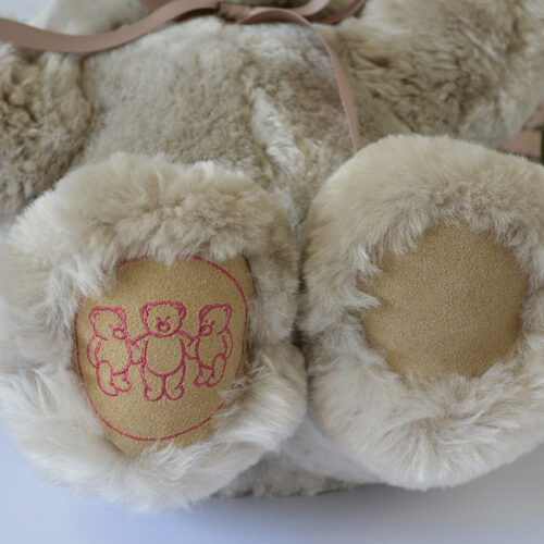 Tambo Teddy Basil logo bear