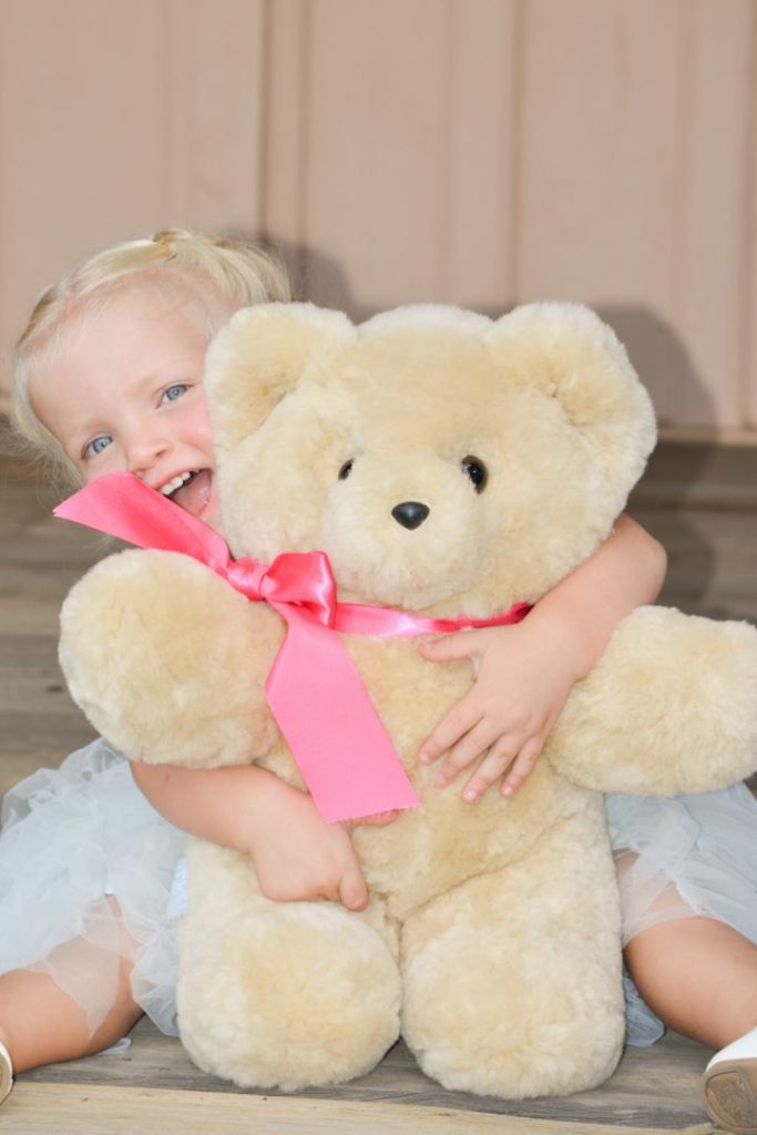 Millie jsut loves huggin her Tambo Teddy Bear