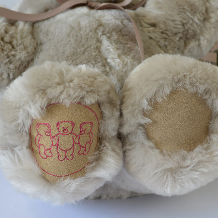 Tambo Teddy Basil logo bear